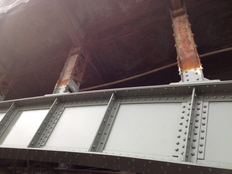 Riveted bridge steel after repair, newly painted